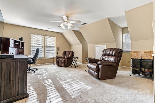 office space featuring ceiling fan, light colored carpet, and lofted ceiling