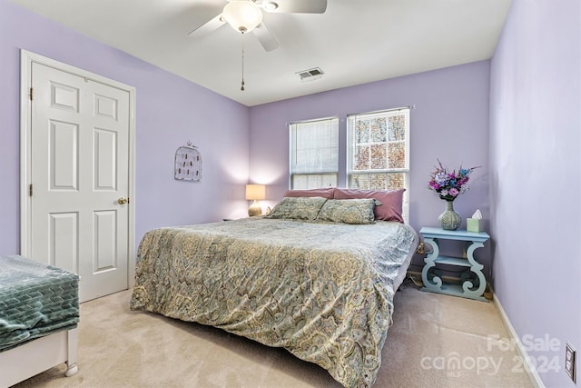 bedroom featuring ceiling fan and light colored carpet