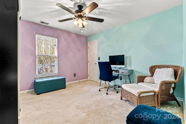 office featuring ceiling fan and light colored carpet