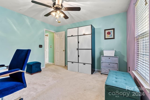 office area featuring ceiling fan and light carpet