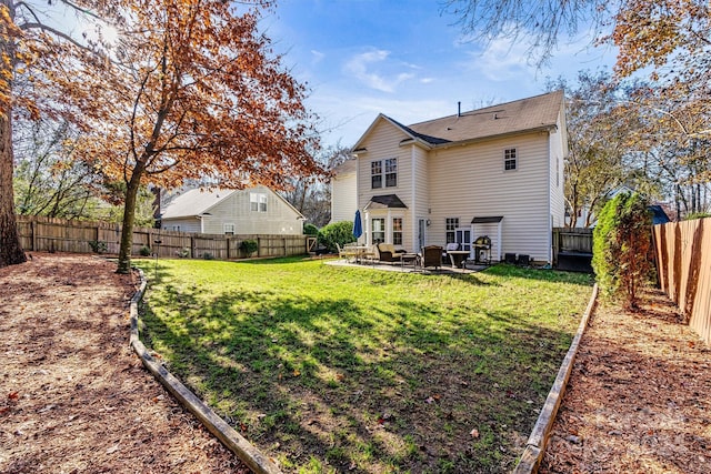 rear view of house featuring outdoor lounge area, a patio, and a lawn