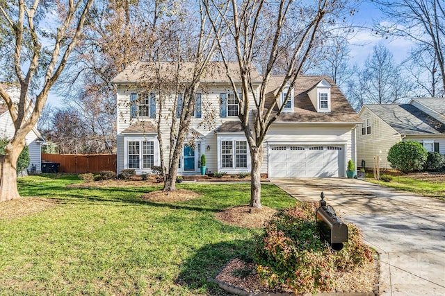 view of front of house with a garage and a front yard