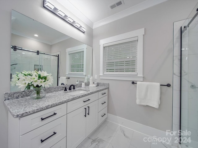 bathroom with vanity, an enclosed shower, and ornamental molding