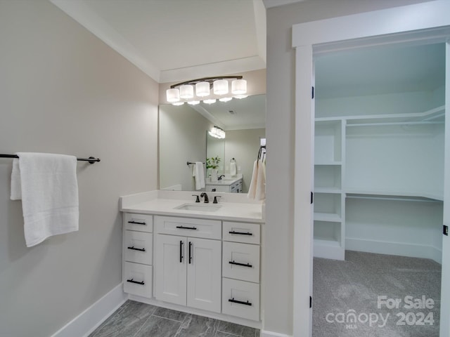 bathroom with vanity and crown molding