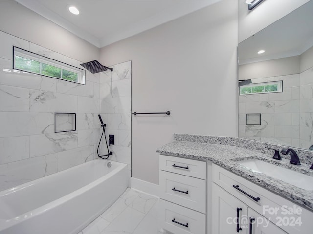 bathroom with vanity and tiled shower / bath