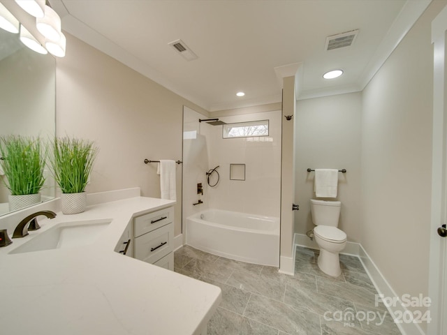 full bathroom featuring vanity, toilet, ornamental molding, and bathing tub / shower combination