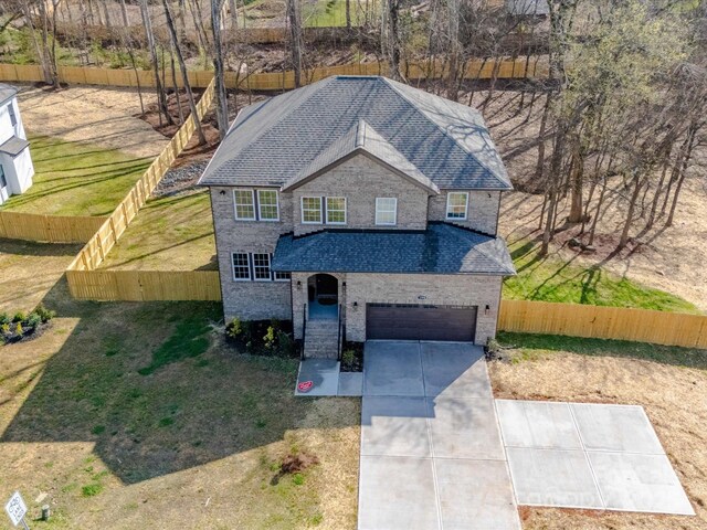 1304 Pleasant Plains Rd, Matthews, NC 28105 - traditional-style home with a shingled roof, driveway, an attached garage, and brick siding