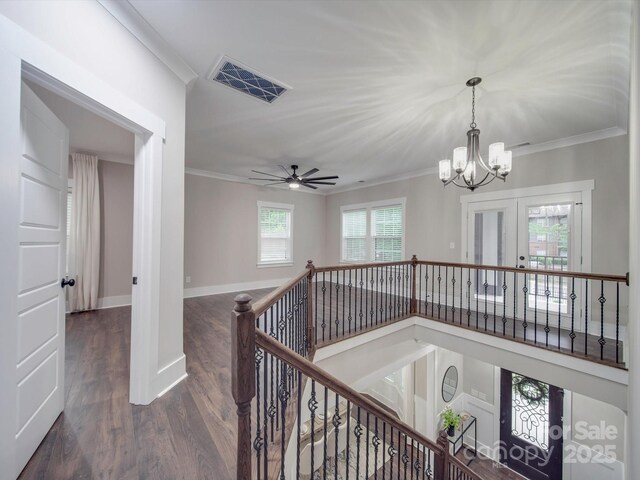 1304 Pleasant Plains Rd, Matthews, NC 28105 - hall with ornamental molding, an upstairs landing, a chandelier, wood finished floors, and baseboards