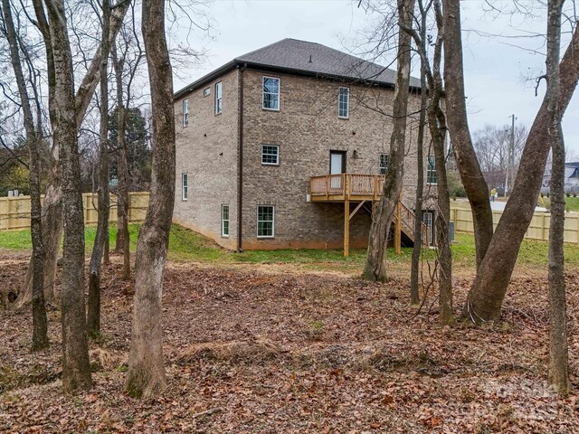 1304 Pleasant Plains Rd, Matthews, NC 28105 - rear view of house featuring a deck, stairway, and brick siding