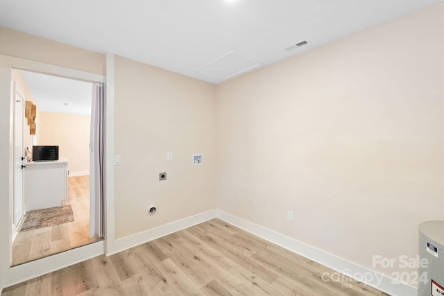 laundry room featuring washer hookup, electric dryer hookup, and light hardwood / wood-style floors