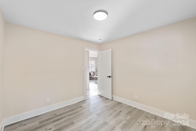 spare room with light wood-type flooring