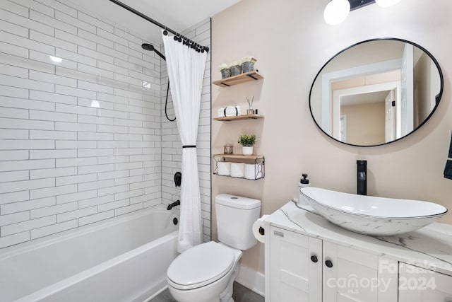 full bathroom with toilet, vanity, and shower / tub combo with curtain