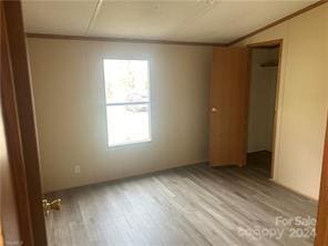 spare room featuring light hardwood / wood-style flooring