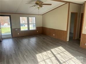 empty room featuring ceiling fan and hardwood / wood-style flooring