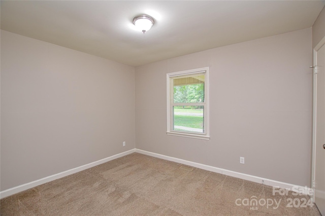 empty room featuring carpet floors