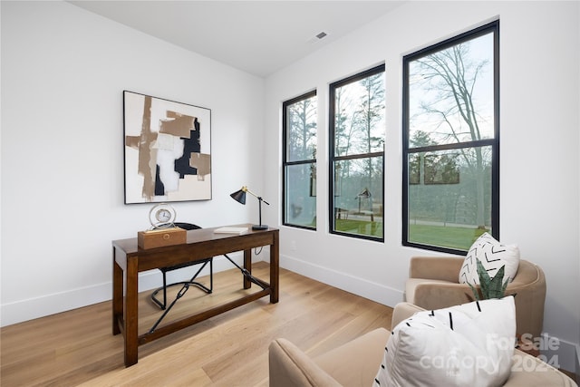 office space with light hardwood / wood-style floors