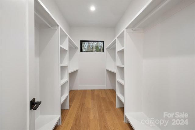 walk in closet featuring light wood-type flooring