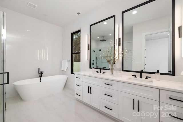 bathroom featuring vanity and plus walk in shower