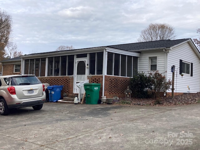 view of front of property with a sunroom