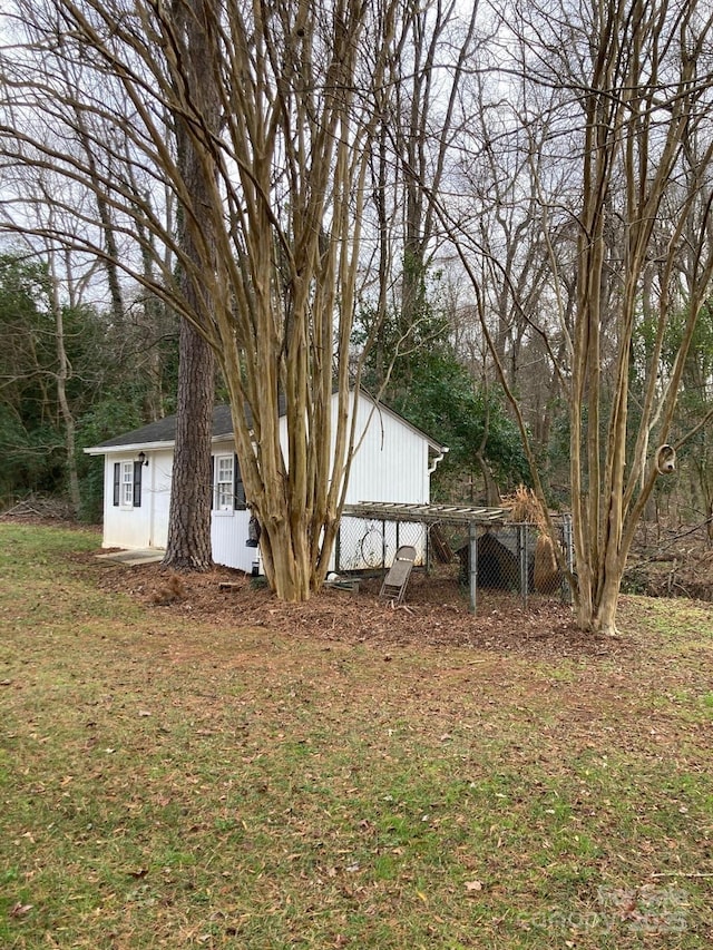 view of side of property featuring a yard