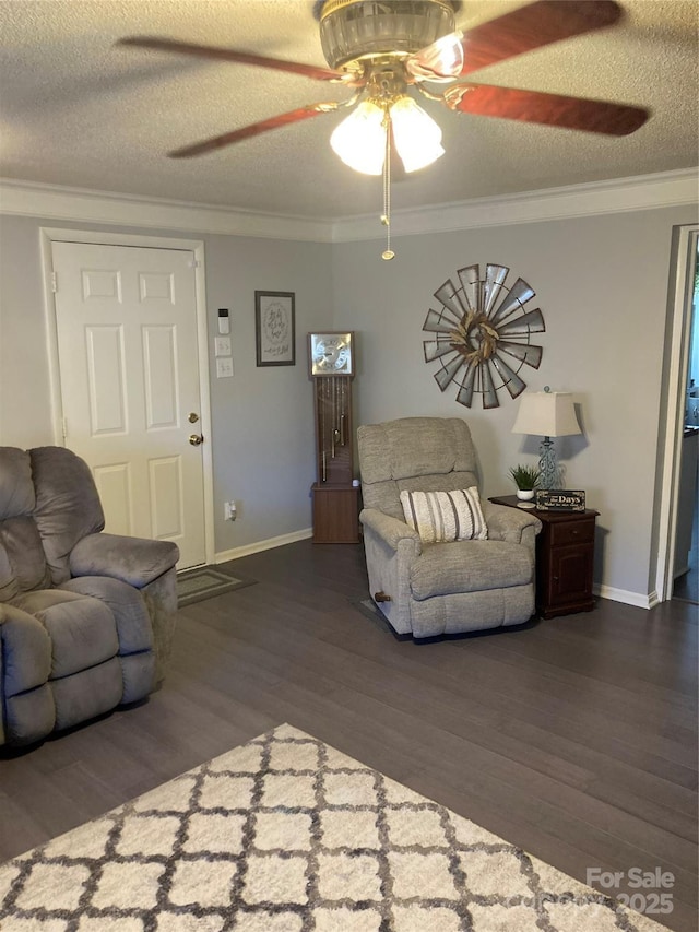 living room with a textured ceiling, dark hardwood / wood-style flooring, and crown molding