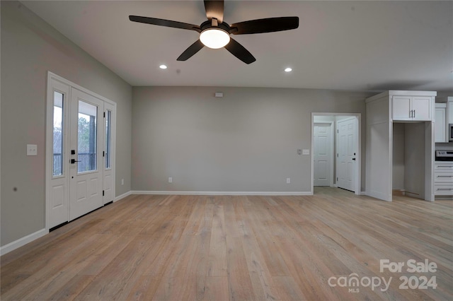 unfurnished living room with ceiling fan and light hardwood / wood-style flooring