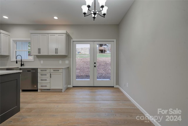 kitchen featuring dishwasher, french doors, light wood-type flooring, and plenty of natural light