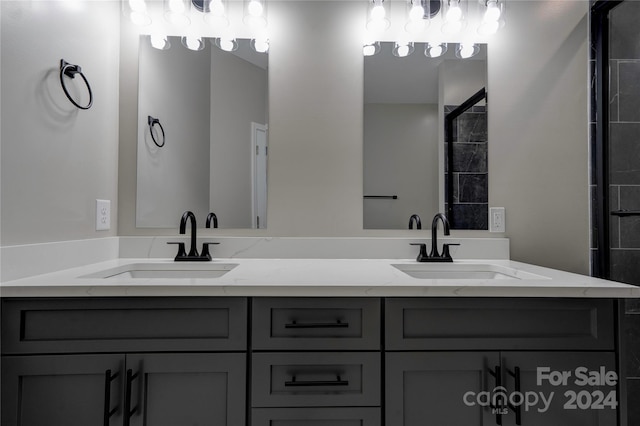 bathroom with vanity and an enclosed shower