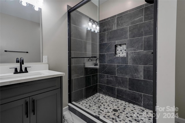 bathroom with vanity and walk in shower