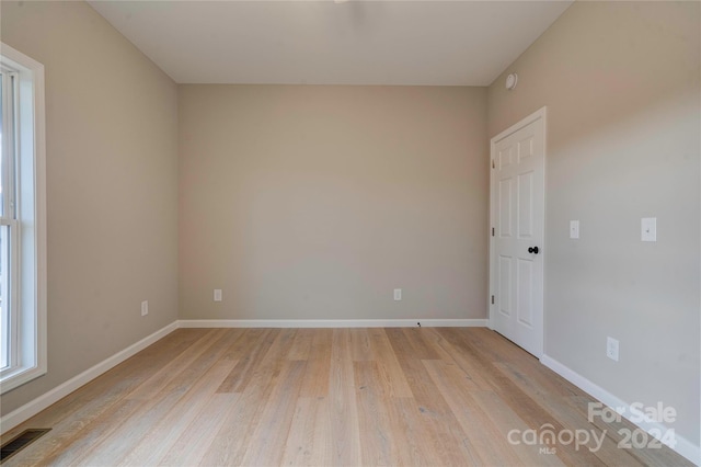 spare room with light hardwood / wood-style flooring