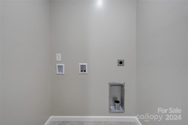 washroom with hookup for a washing machine, tile patterned floors, and electric dryer hookup