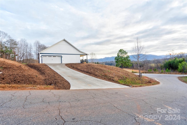 exterior space featuring a mountain view and a garage