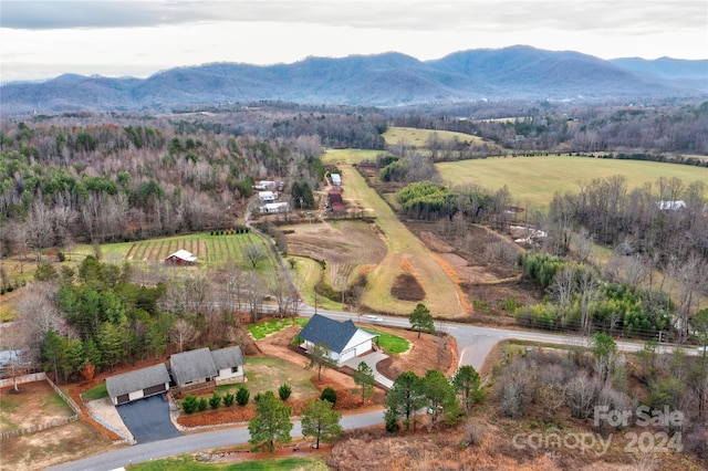 drone / aerial view featuring a mountain view and a rural view