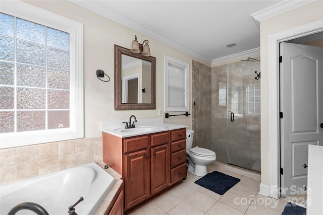 full bathroom featuring tile patterned flooring, crown molding, toilet, vanity, and shower with separate bathtub