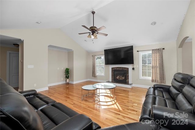 living room featuring hardwood / wood-style floors, ceiling fan, and lofted ceiling