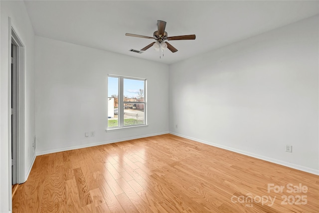 unfurnished room with light hardwood / wood-style flooring and ceiling fan