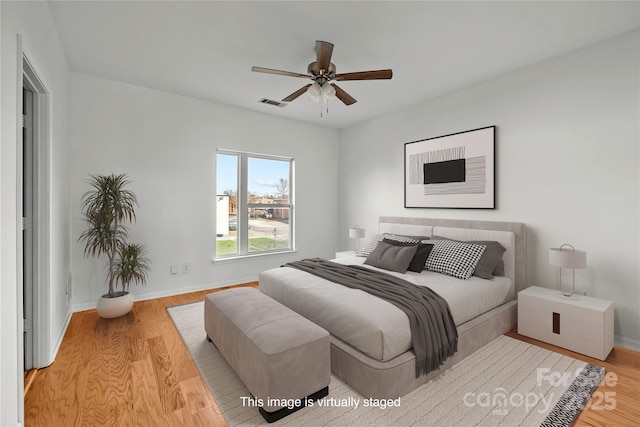 bedroom featuring ceiling fan and light hardwood / wood-style floors