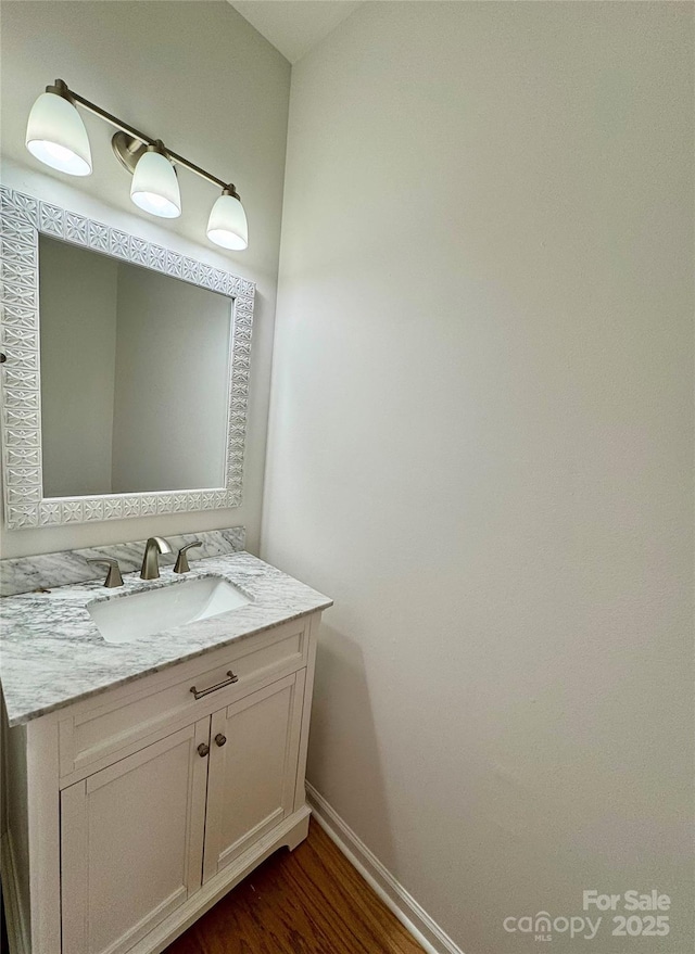 bathroom with wood-type flooring and vanity