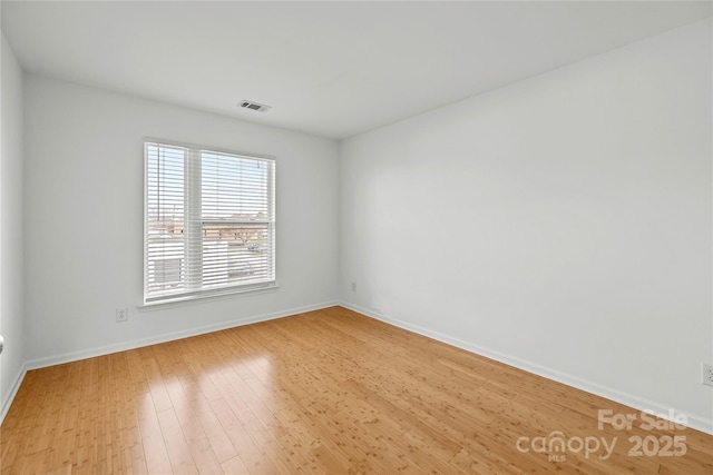 empty room with light wood-type flooring