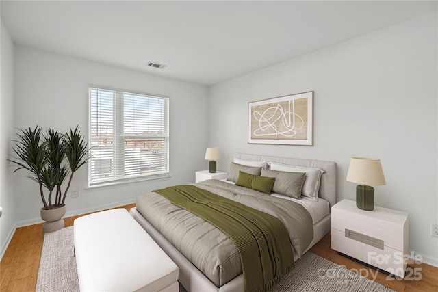 bedroom with hardwood / wood-style flooring