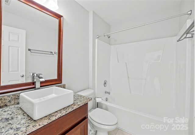 full bathroom featuring shower / bathing tub combination, vanity, and toilet