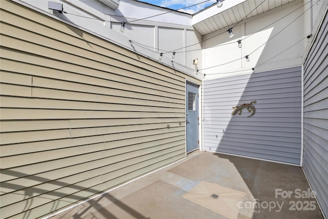 doorway to property featuring a patio area