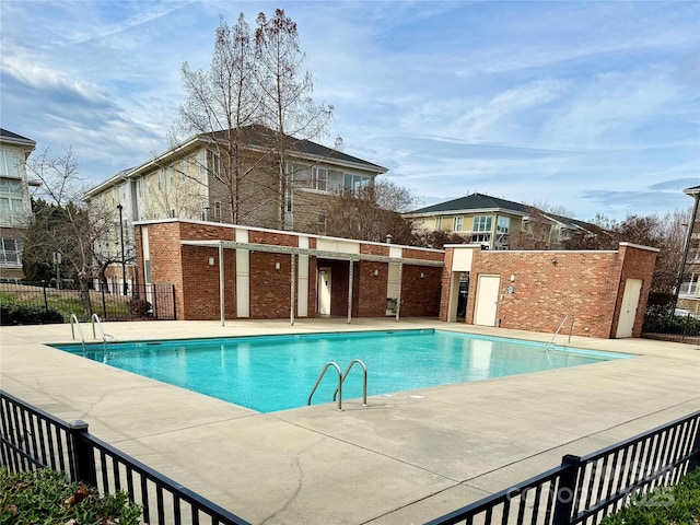 view of swimming pool with a patio