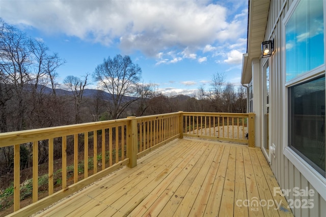 wooden deck featuring a mountain view