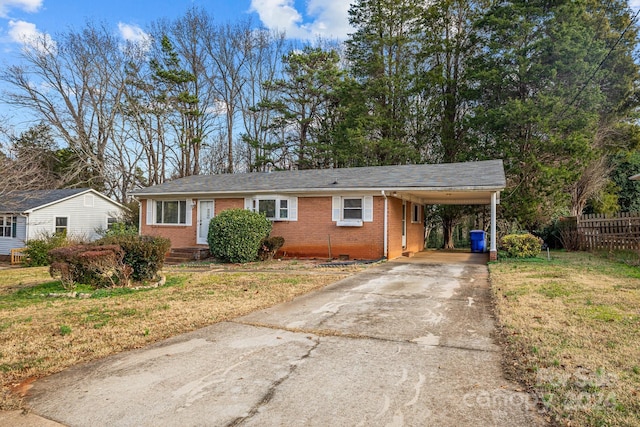 single story home with a front yard and a carport