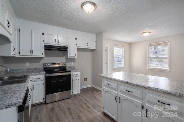 kitchen with sink, a textured ceiling, appliances with stainless steel finishes, dark hardwood / wood-style flooring, and white cabinetry