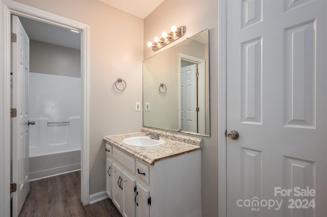 bathroom featuring hardwood / wood-style floors and vanity