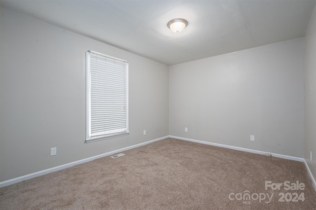 unfurnished room with carpet floors