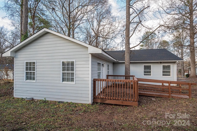 rear view of house with a deck