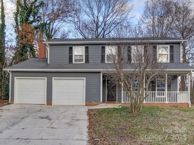 front facade with a front yard and a garage